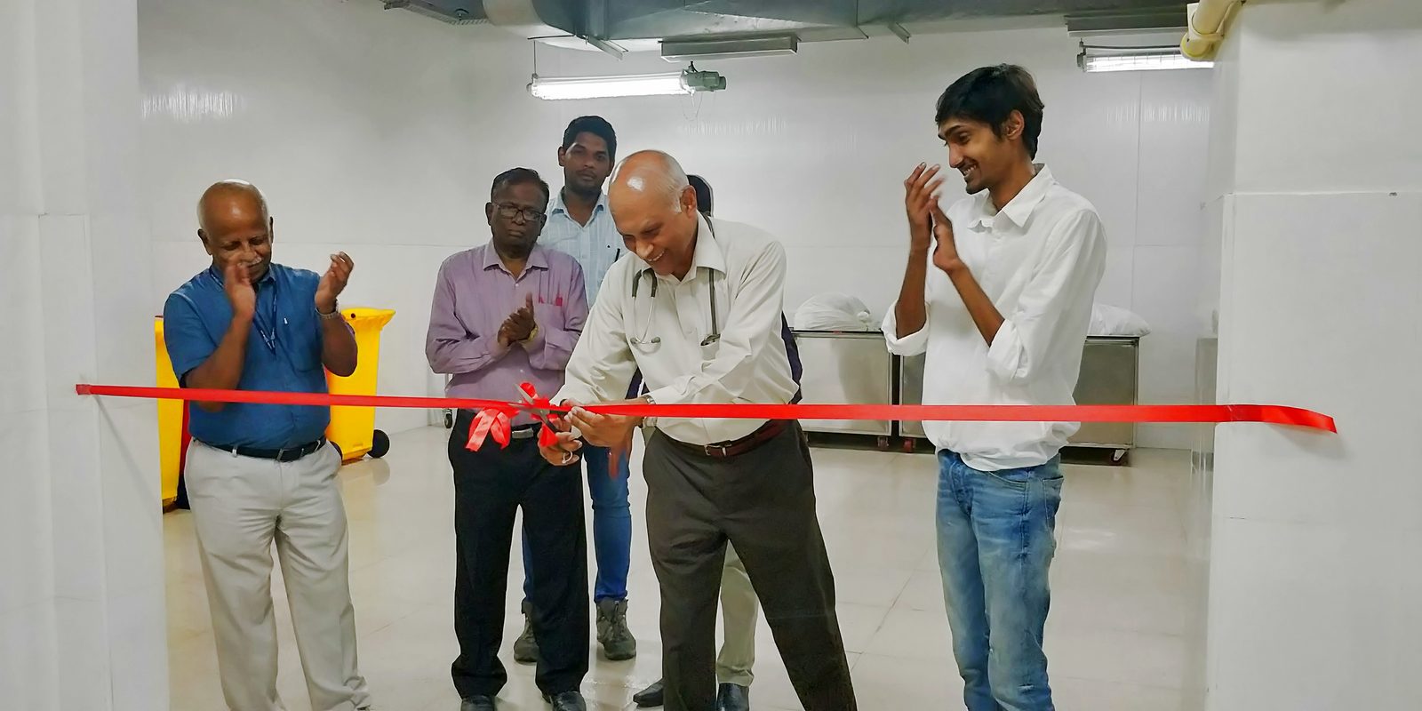 Ribbon-cutting to inaugurate the on-premise hospital laundry unit set up by The Laundry Bag at Tata Medical Center, with founder Shourya Jain and senior doctors present.
